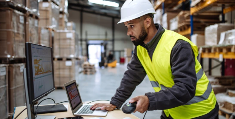 A worker using the computer. 