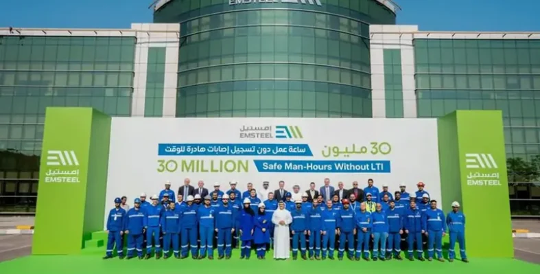 Representatives from EMSTEEL standing outside the company's headquarters.