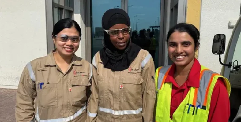 Three women in Acciona's Operational Skills Development Program for Women wearing personal protective equipment. 