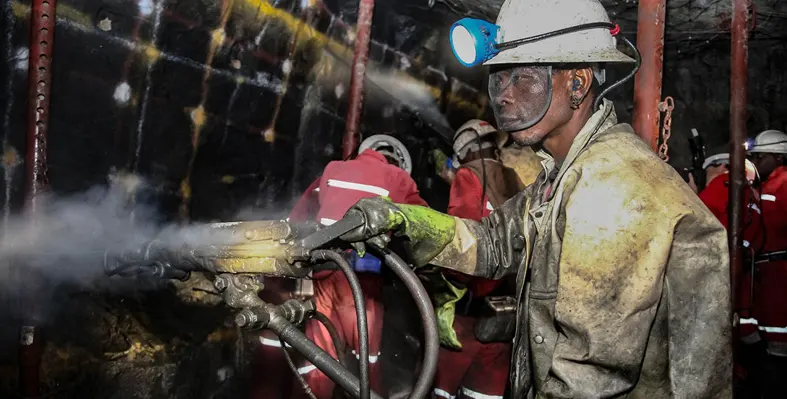 Black mining worker with hard hat and visor