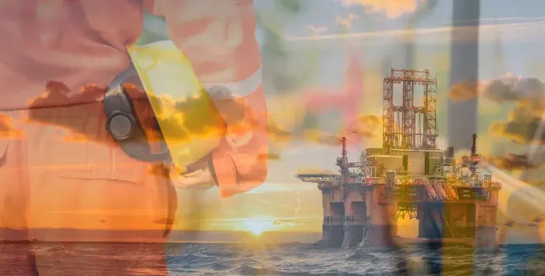 oil_worker_with_offshore_rig_in_the_background