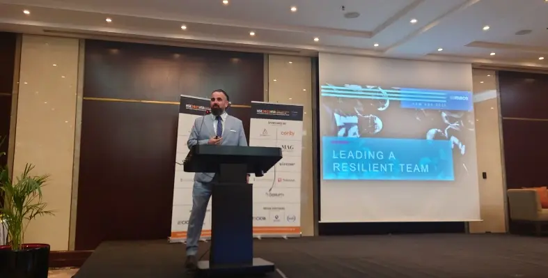 Blair Boyd at the podium presenting 'Leading a Resilient Team' 