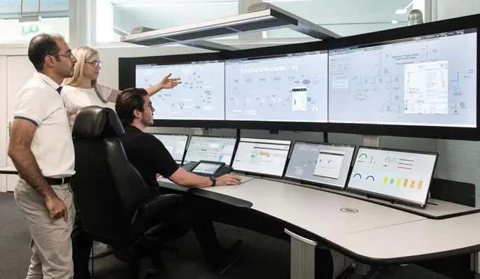 Picture of personnel in a control room